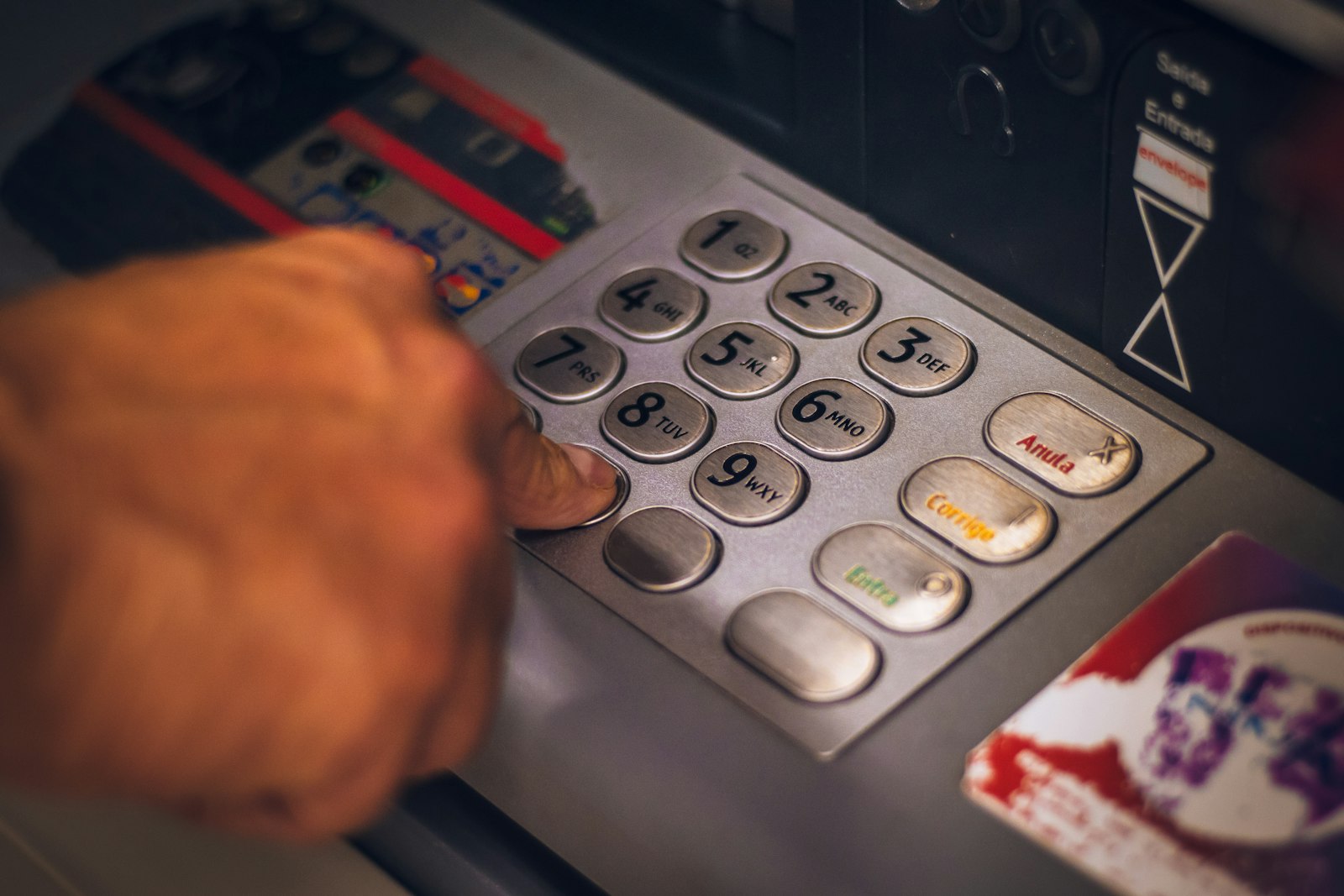 Person tapping a prepaid card on a mobile payment reader